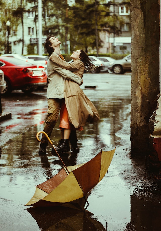 couple dancing in the rain