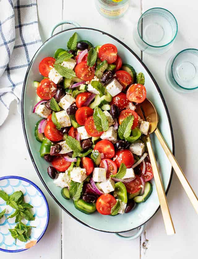 Greek Salad Meal Prepped in Blue Serving Dish