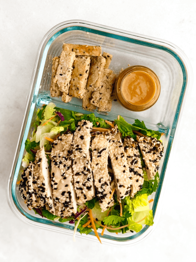 meal prep container with erewhon asian chicken salad