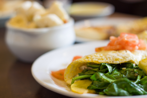 Protein-rich vegetable omelette filled with spinach and smoked salmon.