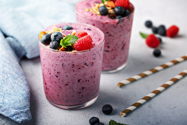 High protein berry smoothie with fresh berries and oats, served in a glass.