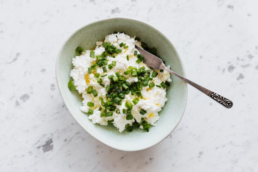 High protein low carb cottage cheese topped with green onions.