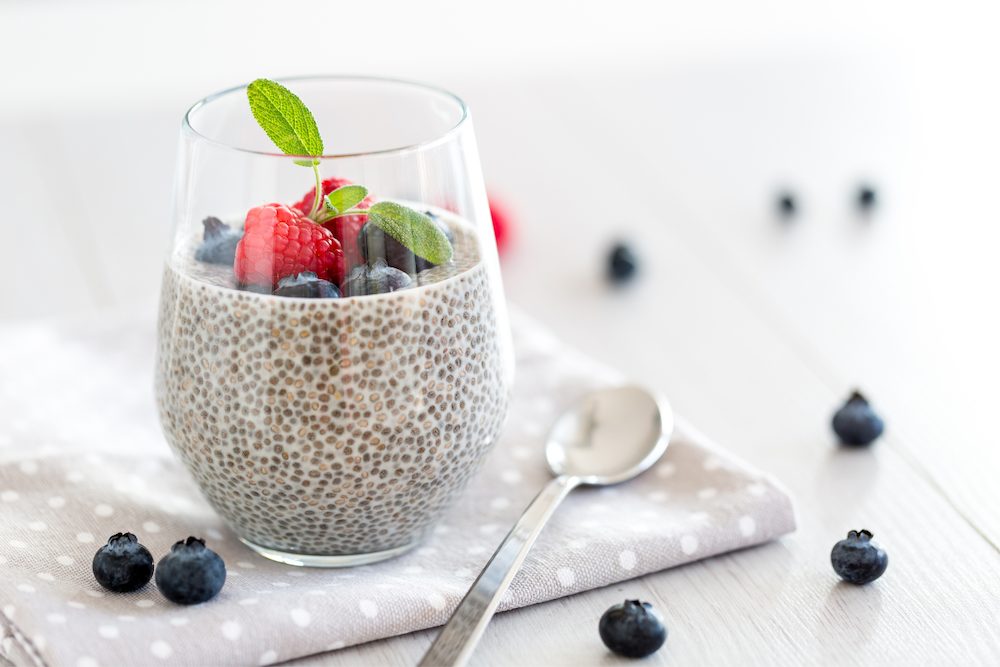 High protein low carb chia seed pudding topped with fresh berries.