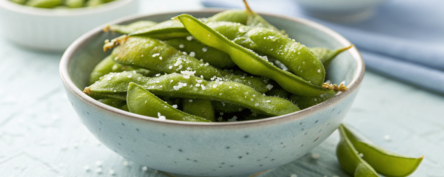 Steamed and salted edamame beans in a bowl – a plant-based high-protein snack.