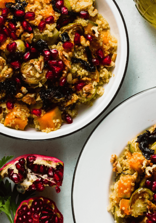 Healthy fall dinner bowl with quinoa, roasted vegetables, pomegranate seeds, and walnuts - perfect for cozy fall dinner ideas and healthy fall recipes.