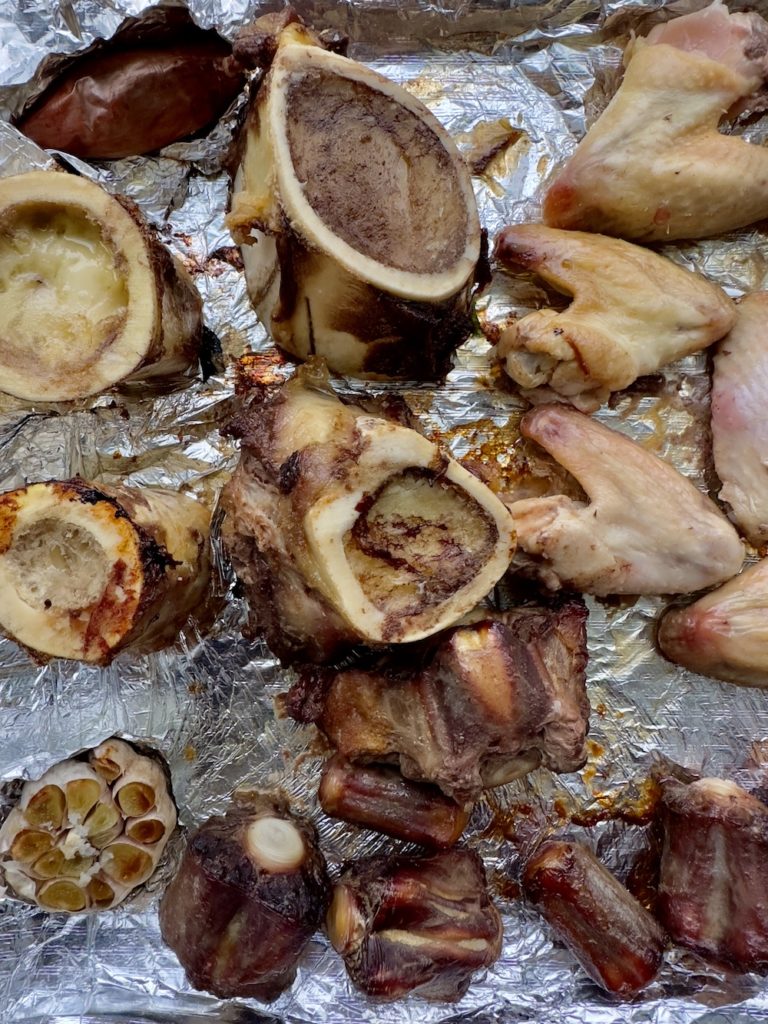 crockpot bone broth bones roasting on sheet pan