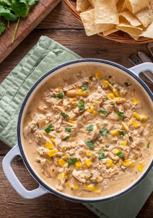 Creamy crockpot chicken recipe with corn, beans, and green chiles, perfect for easy, healthy crockpot meals.