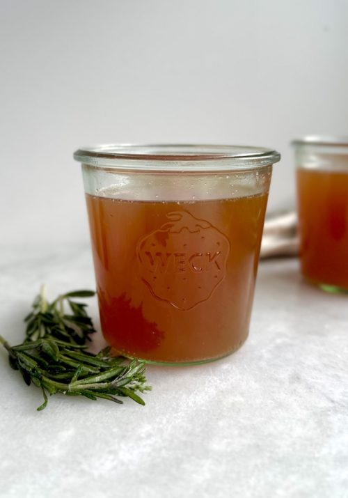 slow cooker bone broth in a glass container