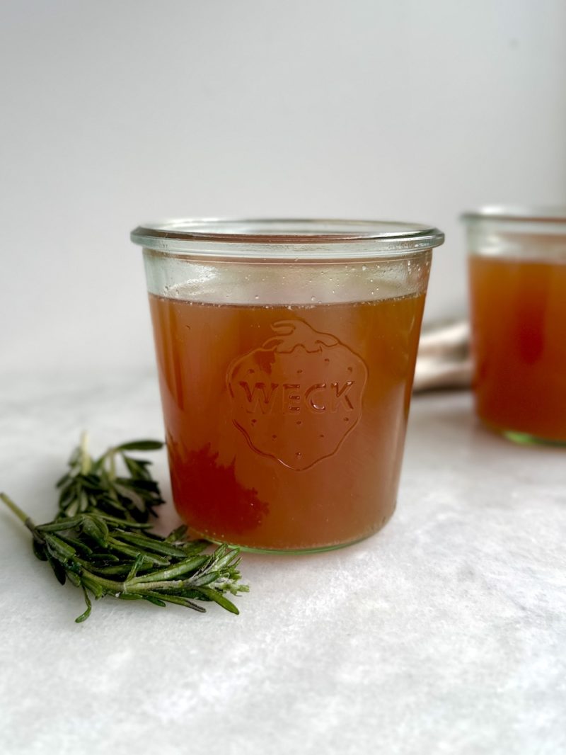 slow cooker bone broth in a glass container