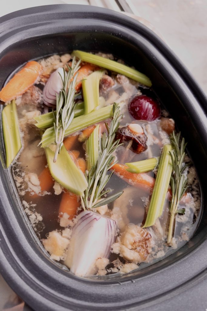 all the ingredients of slow cook bone broth in a crockpot