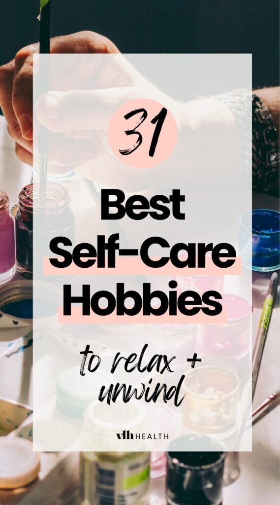 A hand dipping a paintbrush into a jar of paint, surrounded by colorful paint pots, overlaid with text reading "31 Best Self-Care Hobbies to Relax & Unwind" for a wellness-focused blog post.