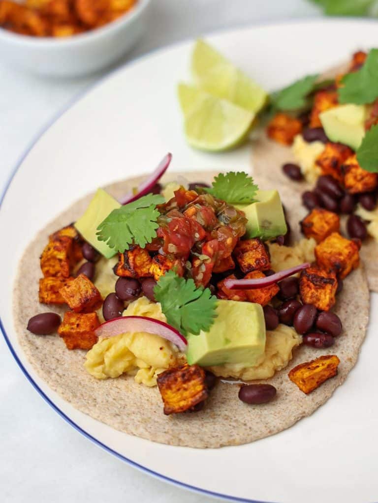 Sweet potato and black bean breakfast taco with scrambled eggs and salsa