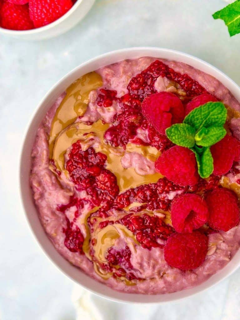 Raspberry protein oatmeal with chia jam and peanut butter swirl