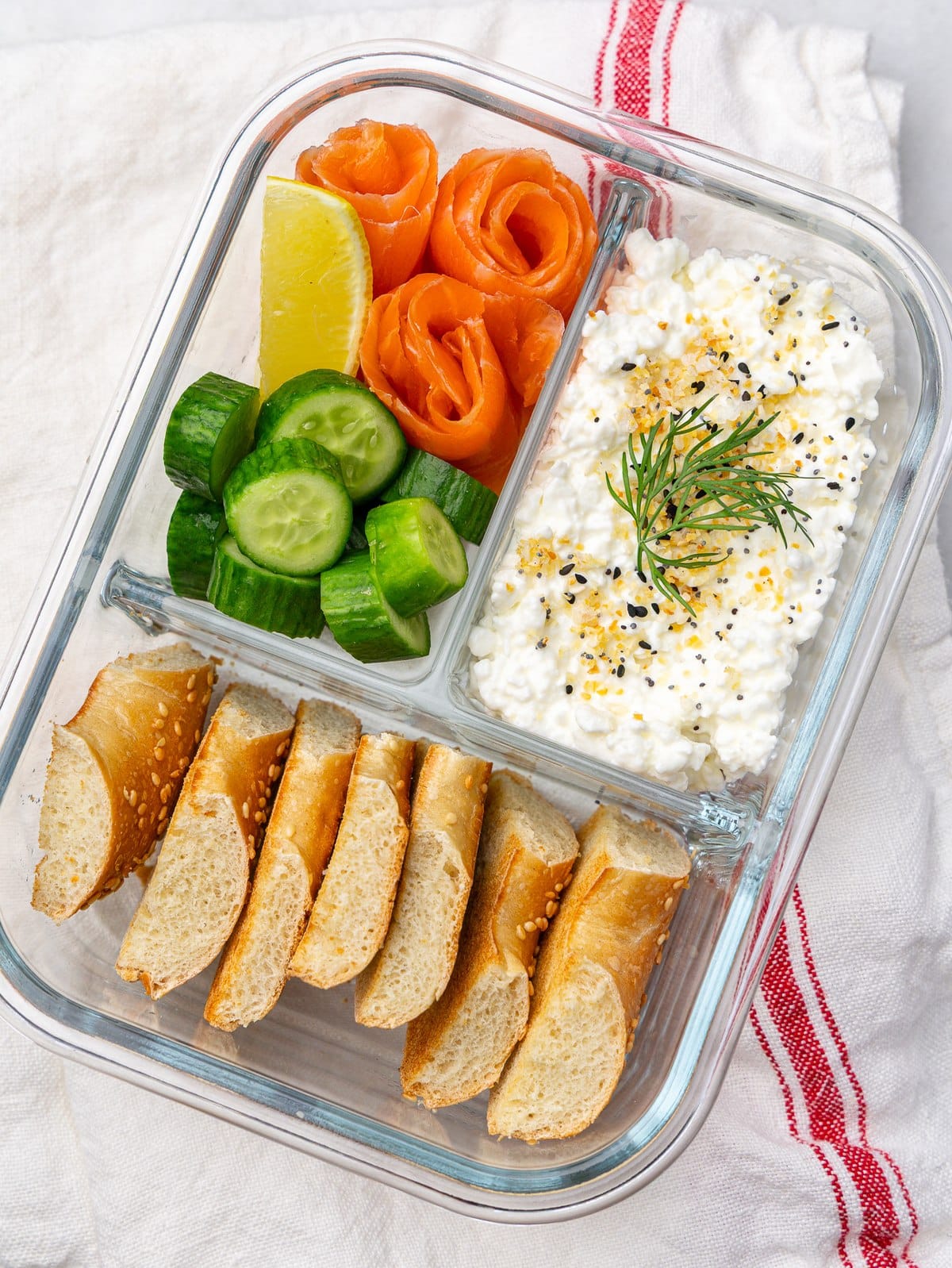 High protein lunch box ideas smoked salmon bagel box with cottage cheese, cucumber and lemon