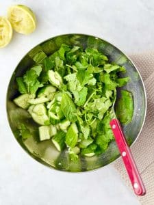 Fresh cucumber herb salad with cilantro, mint, and lime. A cooling side dish for Indonesian chicken satay.