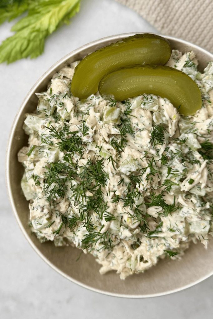 Shredded chicken salad with chopped dill pickles, celery, and creamy dressing — a low calorie lunch packed with protein and crunch.