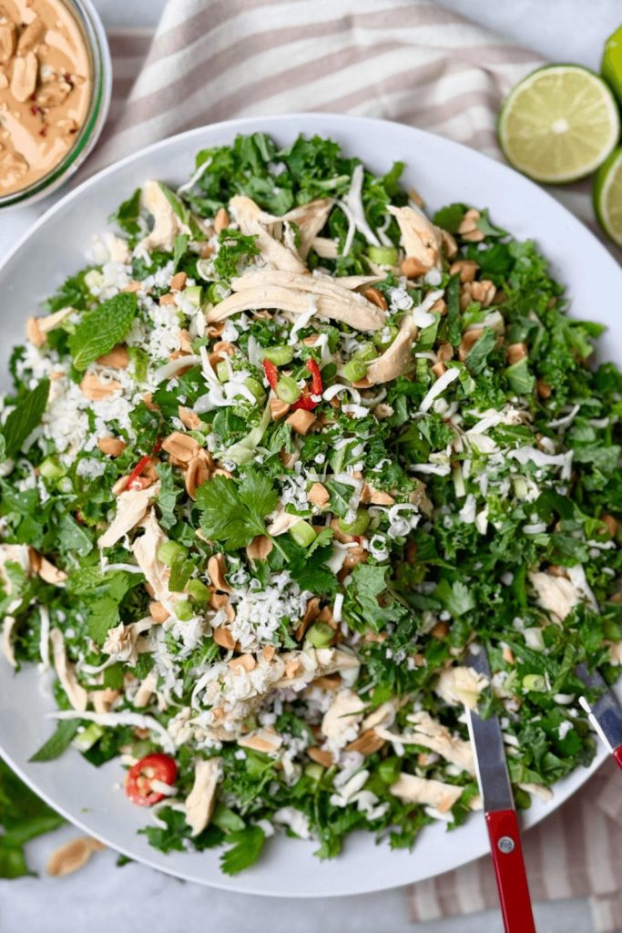 Shredded kale and rotisserie chicken salad with herbs, peanuts, and lime — a healthy high protein low calorie lunch option inspired by Hillstone.