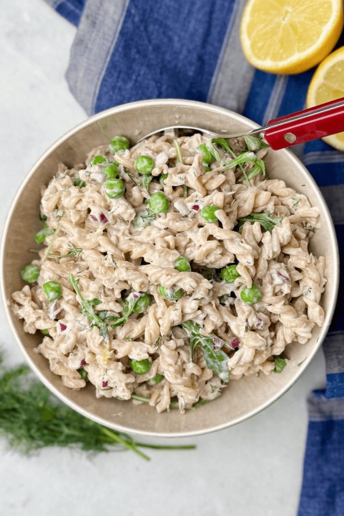 Healthy tuna pasta salad made with Greek yogurt, fresh dill, and green peas — an easy, high protein lunch recipe under 500 calories.