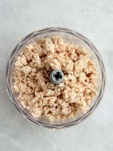 Finely shredded rotisserie chicken pulsed in a food processor to make healthy buffalo chicken salad.