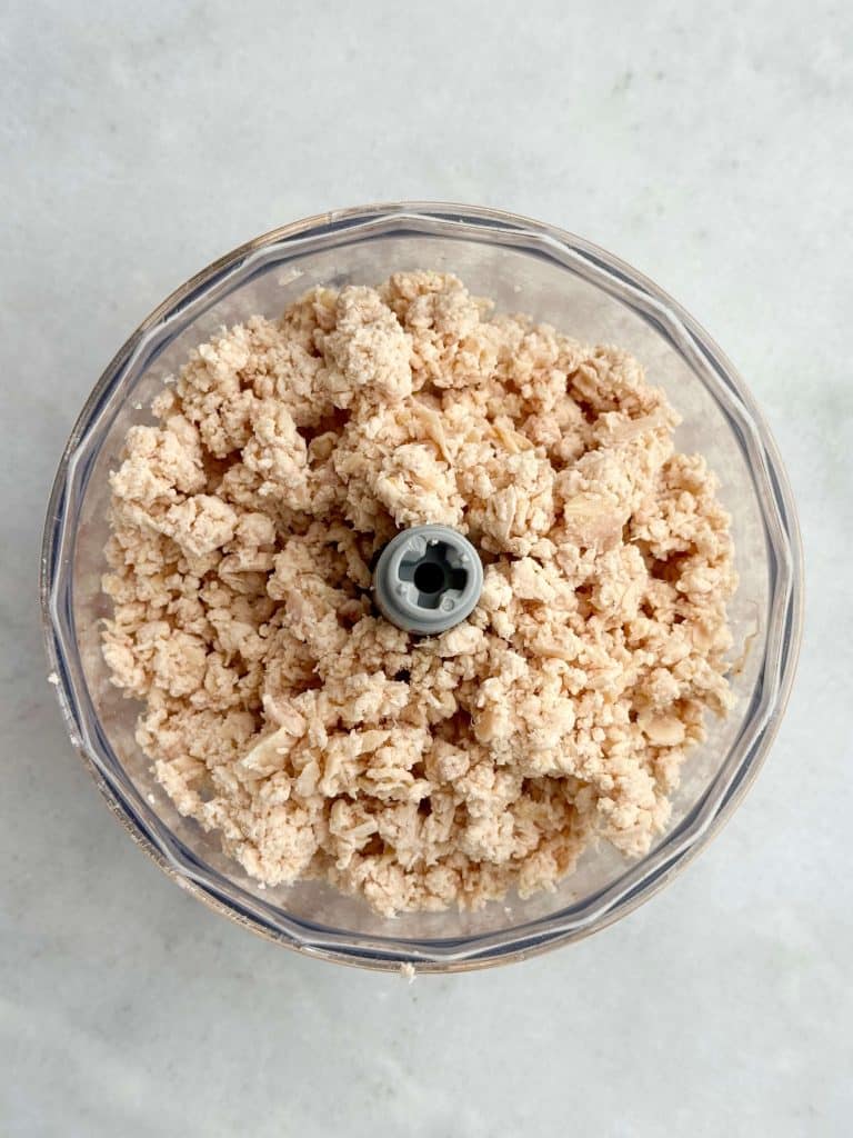 Finely shredded rotisserie chicken pulsed in a food processor to make healthy buffalo chicken salad.