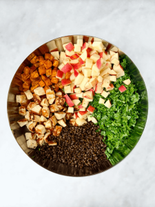 Healthy autumn lentil salad recipe made with roasted sweet potatoes, apple, kale, and golden halloumi cheese.
