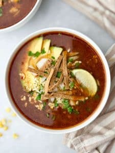 Crockpot Birria Soup with Sweet Corn & Crispy Tortilla Strips