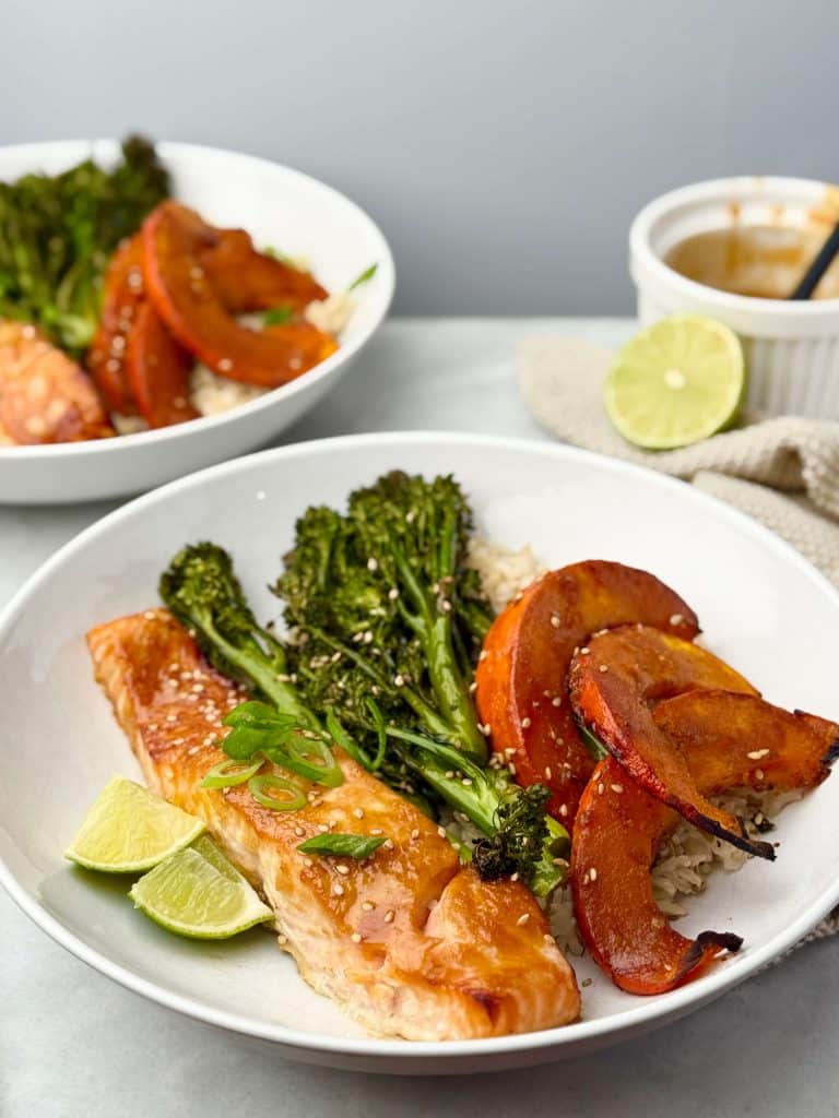 Close-up of perfectly roasted miso-glazed salmon with charred squash and crispy broccolini