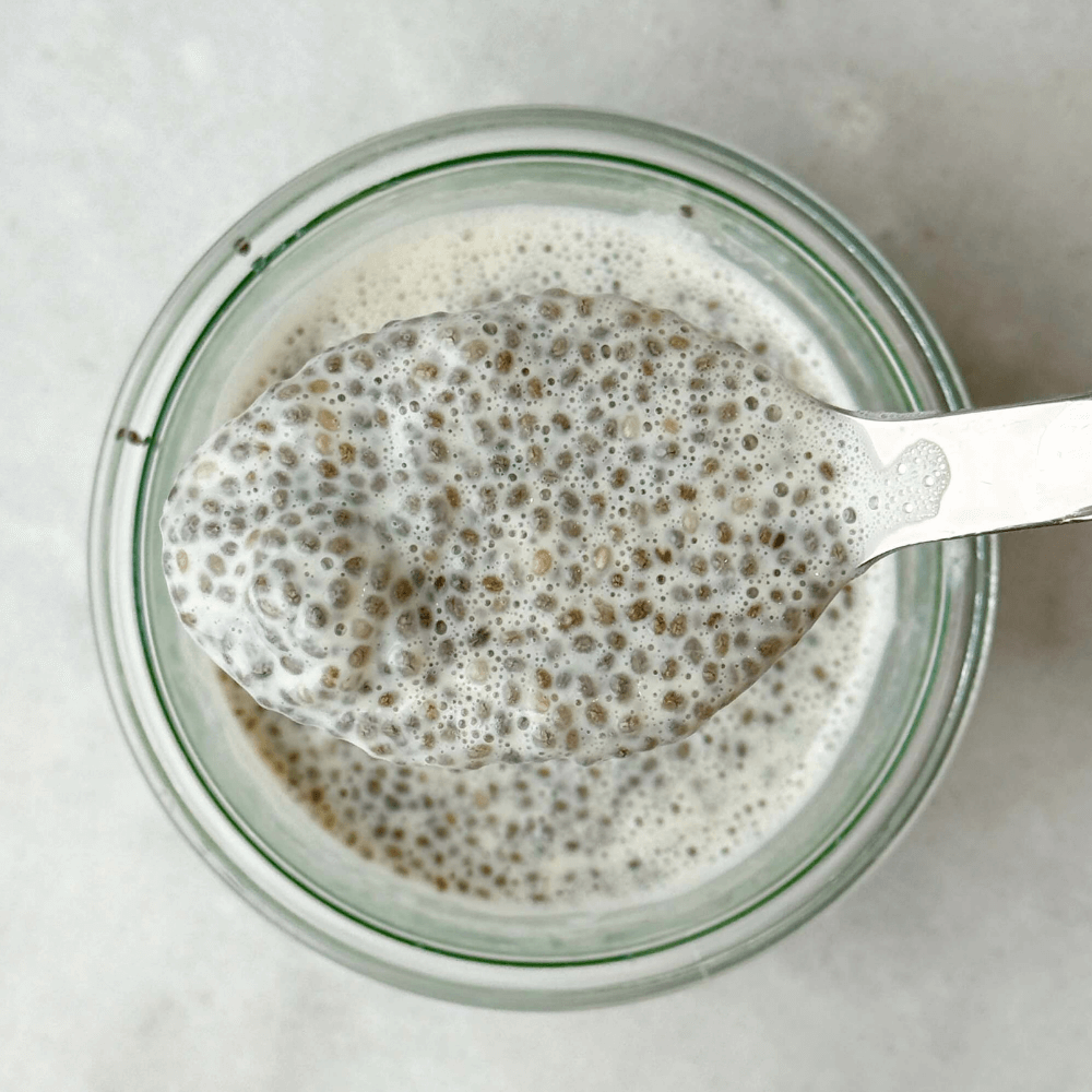 Classic dairy free chia seed pudding with a balanced, spoonable texture in a glass jar.