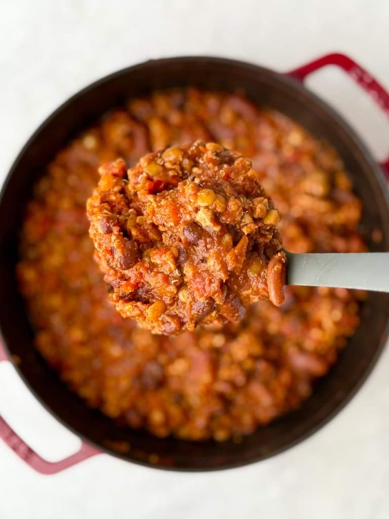 Spoonful of hearty turkey and lentil chili showing the thick, smoky texture of this high protein low calorie recipe.