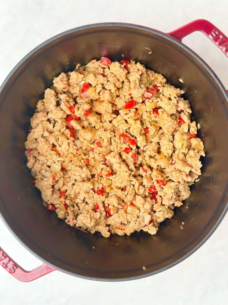 Browning lean ground turkey with onions and peppers while making healthy high protein low calorie chili.
