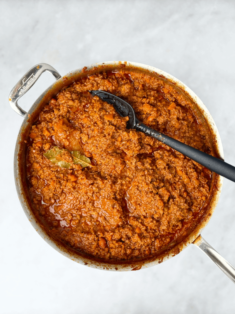 Rich, slow-simmered bolognese sauce with tender meat and vegetables ready for layering in lasagna.