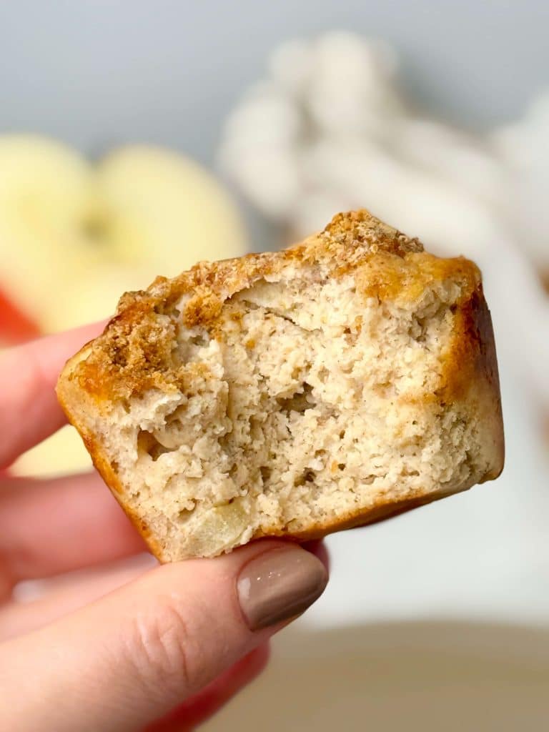 Soft and moist apple cinnamon protein muffin with a crumb topping.