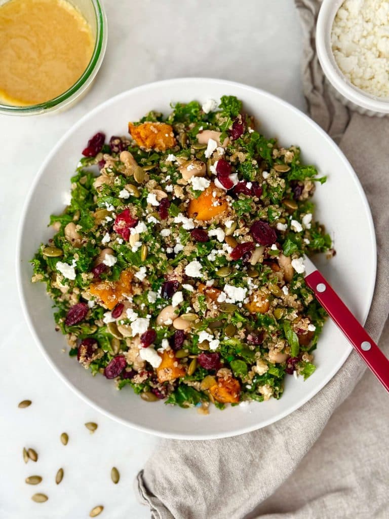 Mixed harvest quinoa salad tossed with brown butter Dijon vinaigrette, kale, squash, cranberries, white beans, and feta.