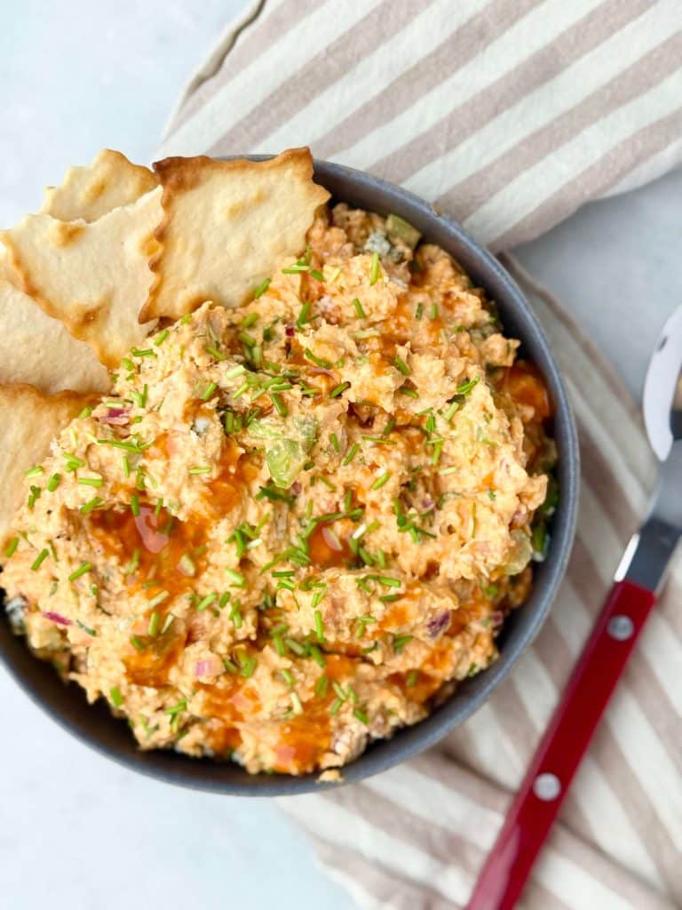 High-protein buffalo chicken salad with shredded chicken, celery, green onions, and a creamy buffalo sauce.