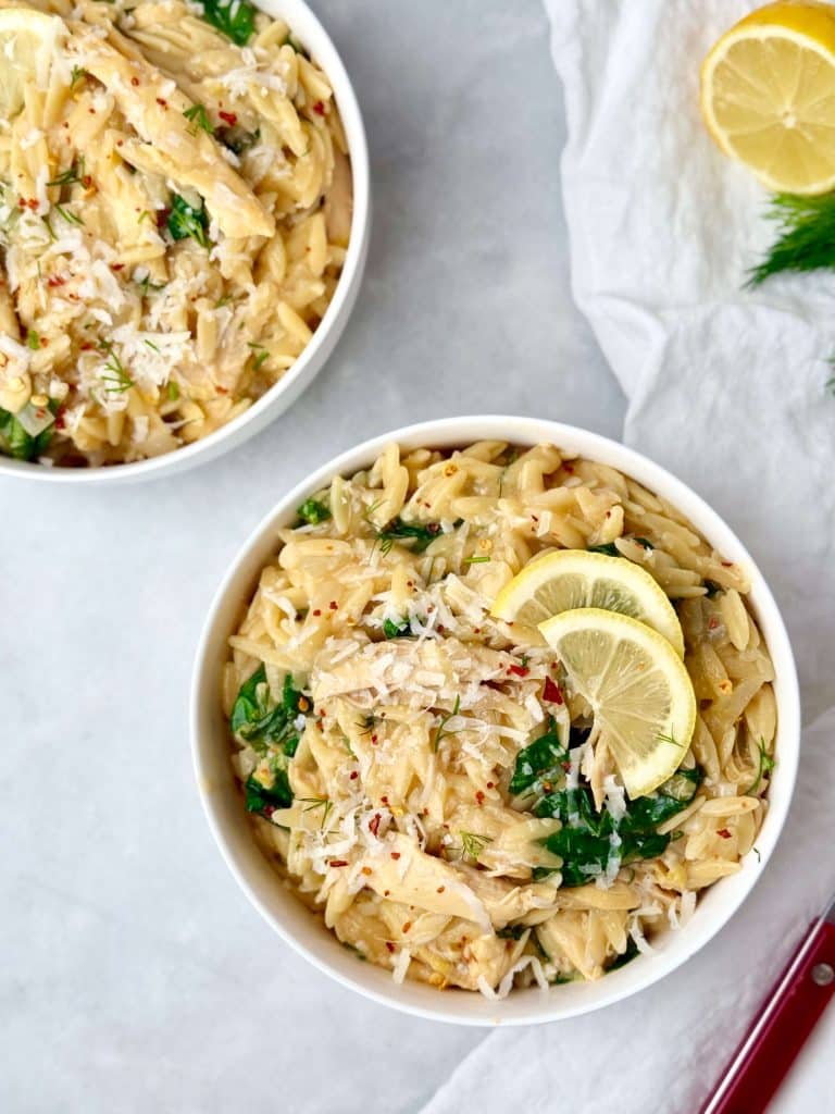 Easy one-pot healthy lemon chicken orzo served in bowls with fresh dill and lemon, a creamy weeknight pasta dish.