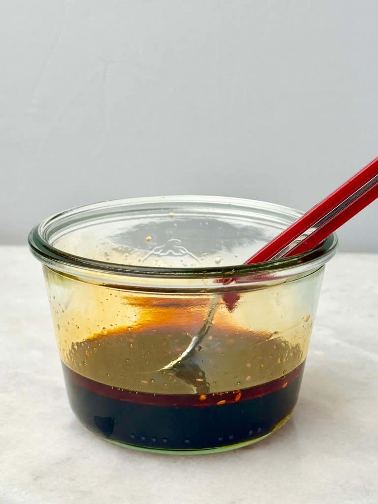 Homemade soy sesame drizzle sauce for high protein salmon bowl