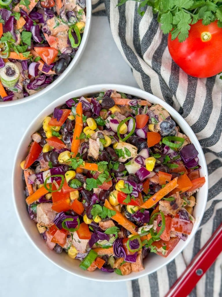 BBQ chicken dense bean salad with black beans, corn, red cabbage, tomatoes, and high-protein ranch dressing.