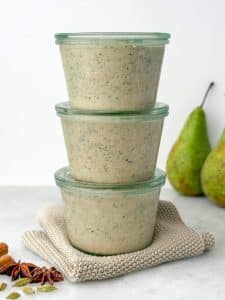 High-protein chai overnight oats portioned into glass containers for easy meal prep breakfasts.