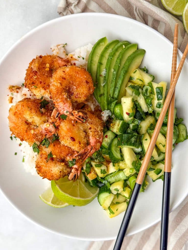 Coconut shrimp bowls made in the air fryer with crispy coconut shrimp, white rice, and fresh pineapple salsa