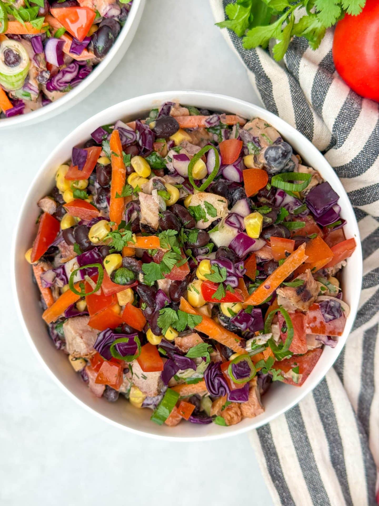 BBQ chicken dense bean salad with black beans, corn, crunchy vegetables, and creamy high-protein ranch dressing.