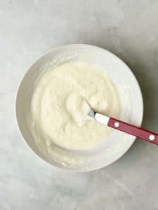 Garlicky yogurt sauce for air fryer chicken shawarma bowls, made with Greek yogurt, fresh garlic, and lemon juice.