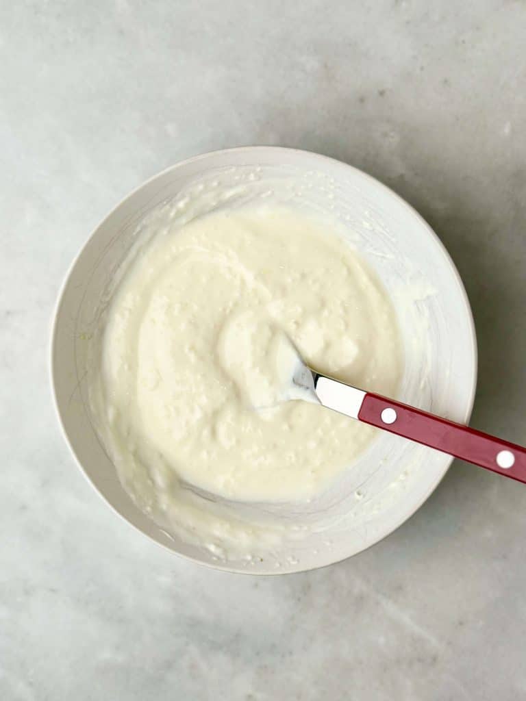 Garlicky yogurt sauce for air fryer chicken shawarma bowls, made with Greek yogurt, fresh garlic, and lemon juice.
