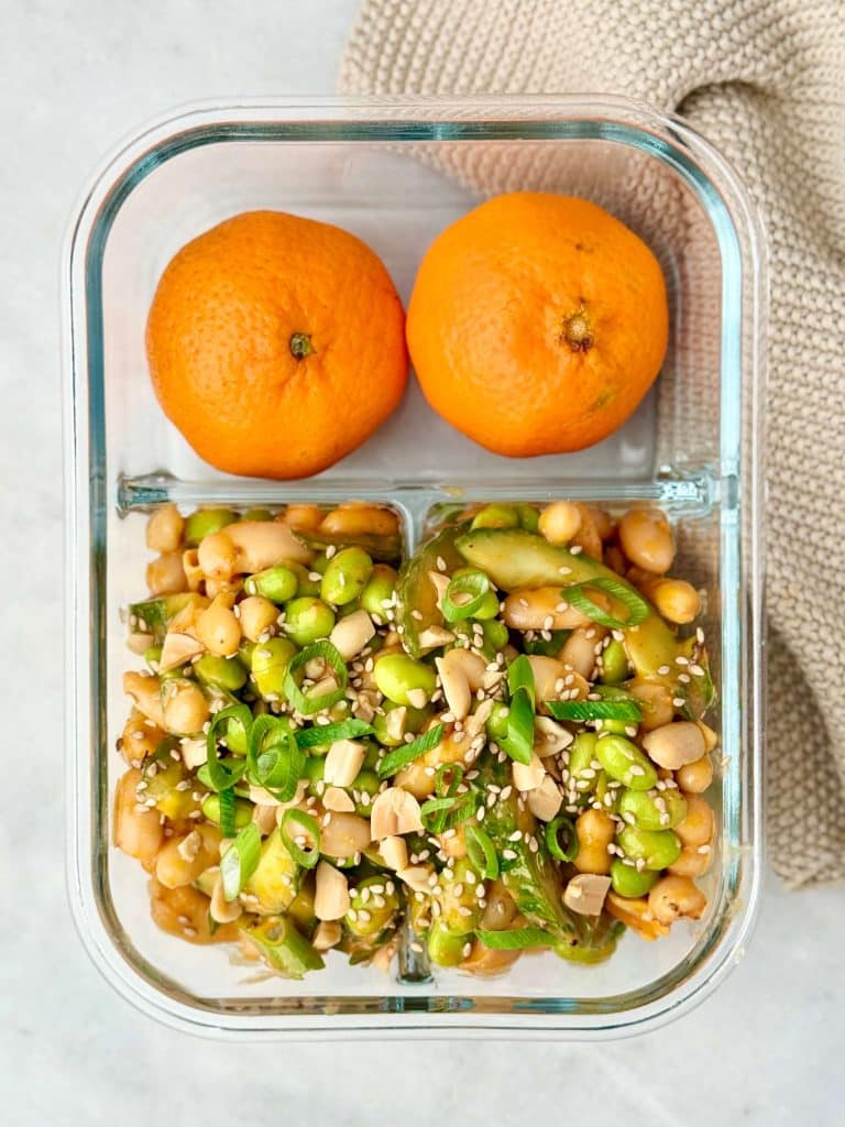 Edamame miso dense bean salad featuring white beans, crunchy cucumber, peanuts, and a savory peanut miso dressing.