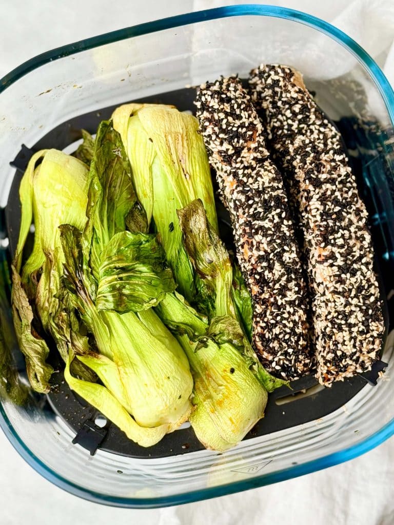 Sesame crusted salmon and bok choy cooking together in the air fryer