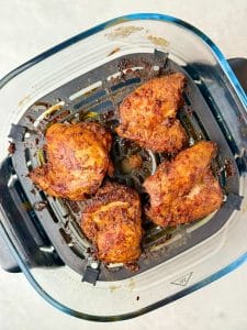 Air fryer chicken shawarma thighs cooked until juicy and lightly crisp, ready to slice for high-protein shawarma bowls.