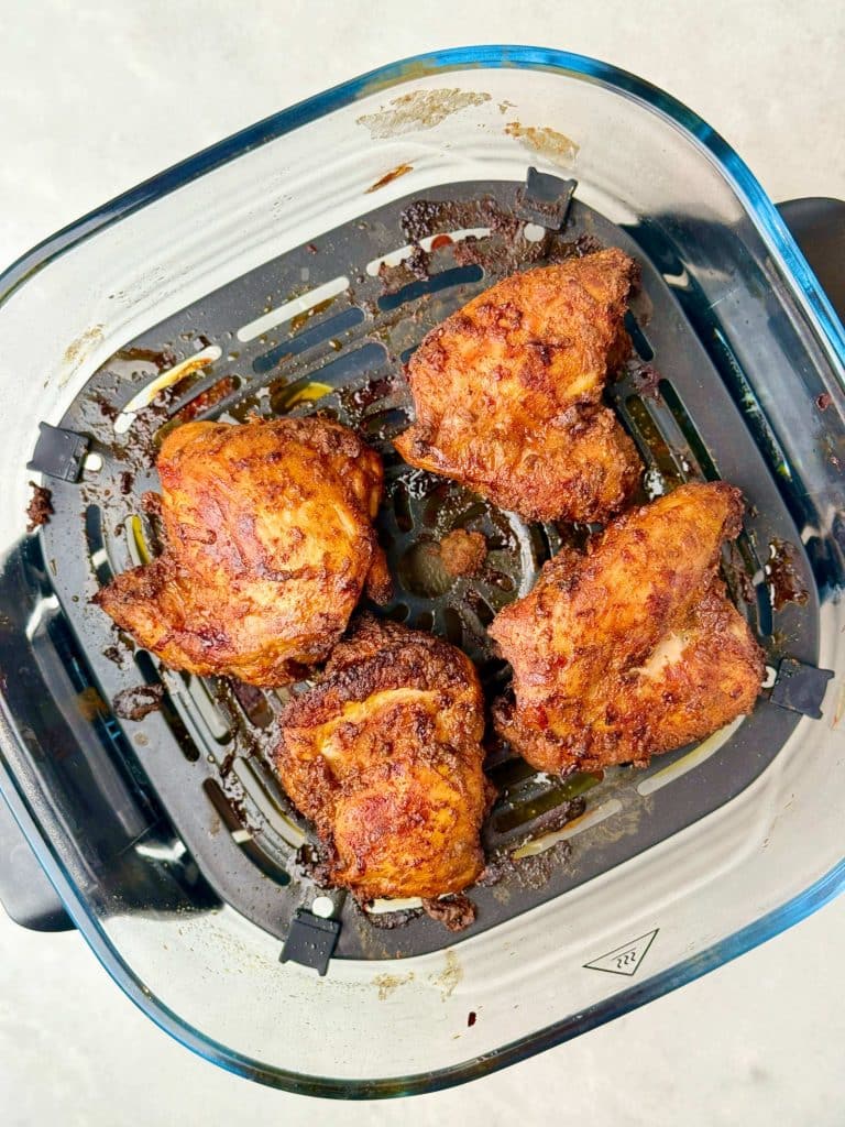 Air fryer chicken shawarma thighs cooked until juicy and lightly crisp, ready to slice for high-protein shawarma bowls.