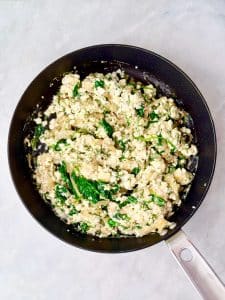 Creamy spinach and feta filling mixed together for a high-protein spanakopita wrap