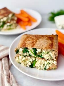Crispy spanakopita wrap served on a plate with a spinach and feta filling