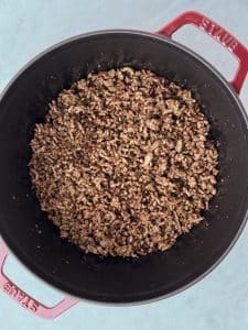 Lean ground beef browned in a large pot as the base for unstuffed cabbage soup