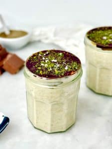 Chocolate pistachio overnight oats inspired by Dubai chocolate, layered with pistachio butter and protein oats